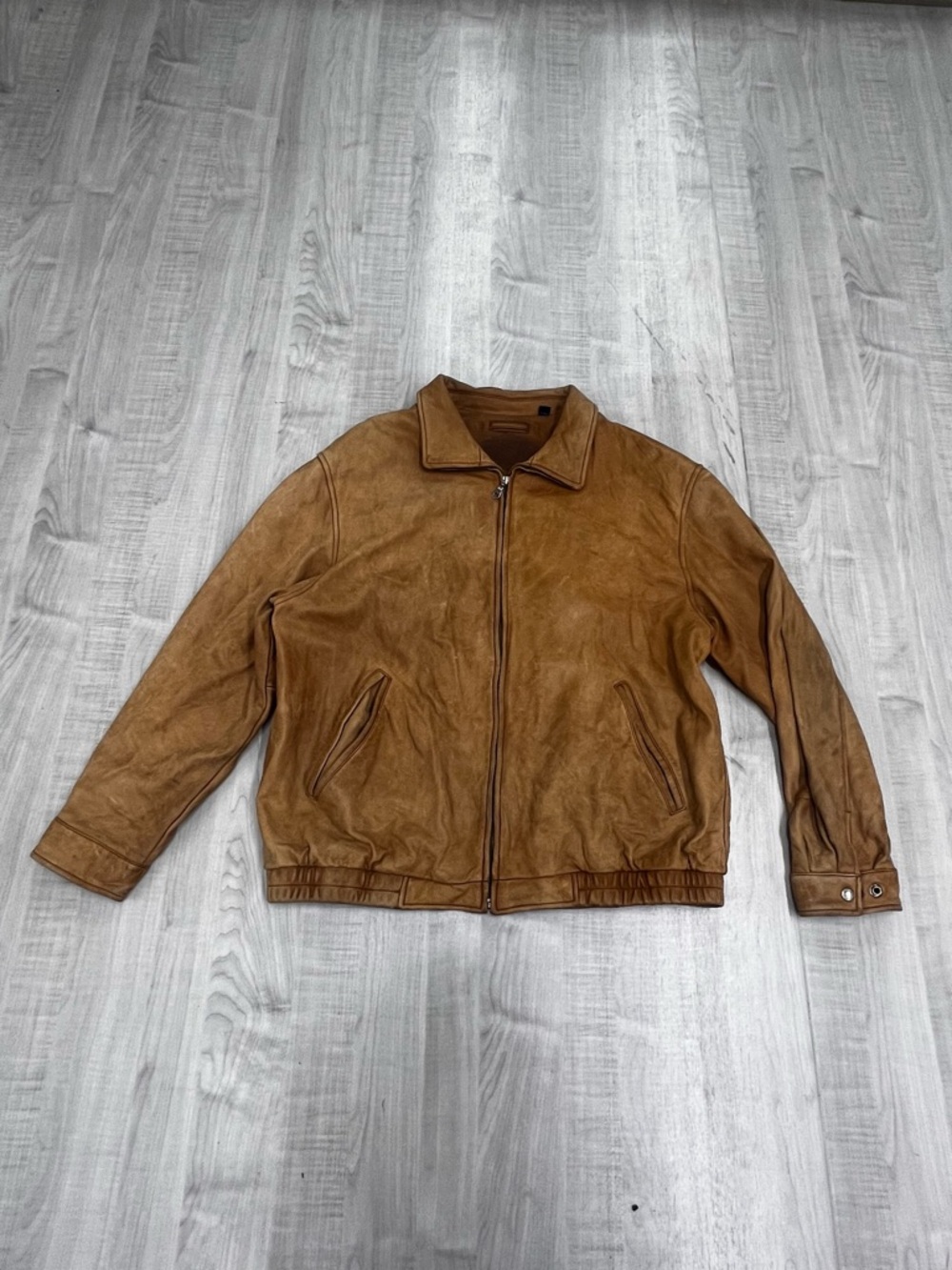Brown bomber leather coat